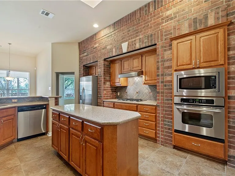 Chef's kitchen with plenty of counterspace and stainless steel appliances