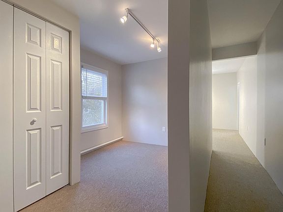 Hallway to office on left and bedroom on the right
