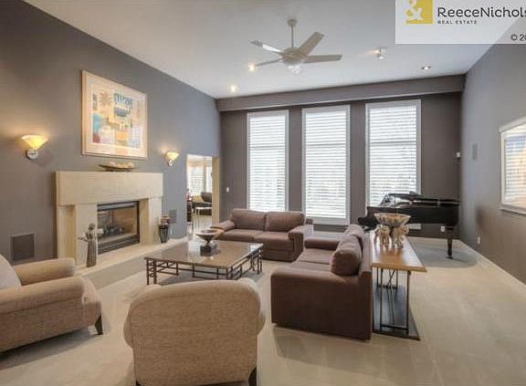 Living too opens to kitchen and hearth room, overlooks patio