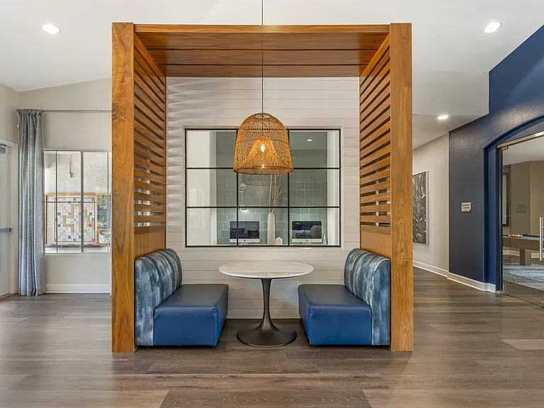 The clubhouse includes a cozy sitting area where neighbors and friends can gather to relax and enjoy each other's company at Ascent at the Galleria.
