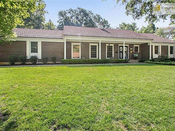 Charming front porch extends across the length of the home.  Nice level lot with large trees great for shade and privacy.  Don't overlook the concrete tile roof and charming cupola on the home!!