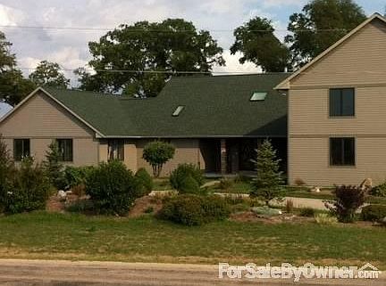 Roadside View
						:
						The drive, large perennial berm, & two smaller gardens greet your guests.