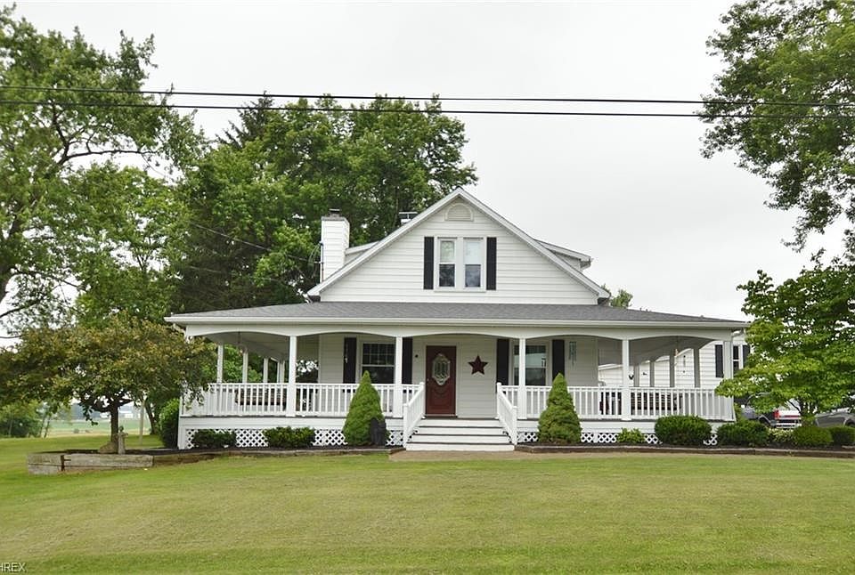 Beautiful Cape Cod resting on 4.0 Acres with wrap around Porch.
