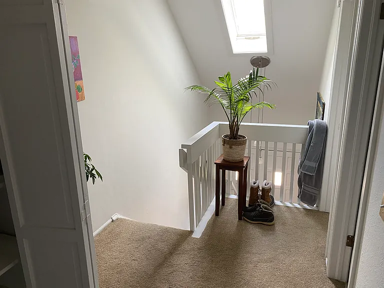 upstairs storage closet and access to bedrooms and the other bathroom