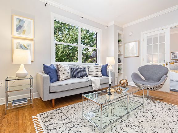 Open, airy feel with abundant windows and abundant light! Court view with lovely tree, oak hardwoods, French doors, period millwork, stylish and soothing colors, open floor plan.