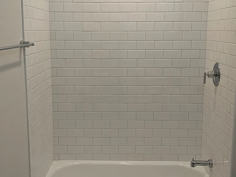 This is a bathroom is was redone at the same time but is in a different unit. It has the same floor and wall tile. I will take pictures of this unit to upload soon.