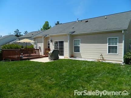 Back View
						:
						Master bedroom, breakfast area & family room have windows/doors to the backyard