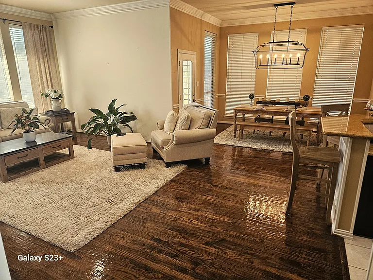 Family room and Breakfast area with table and chairs.