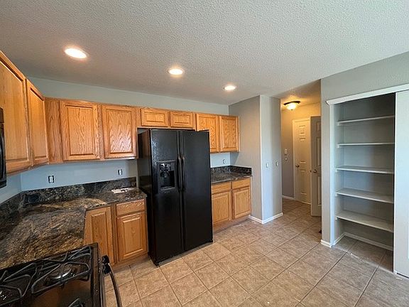 Kitchen towards powder room/garage access