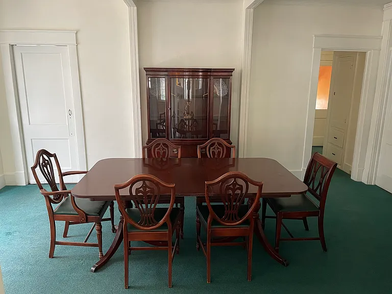Dining room left side has swing door to kitchen