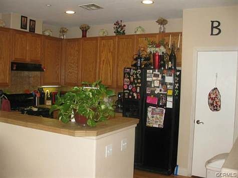 Kitchen with upgraded counter tops and bar area. Ample cupboard
