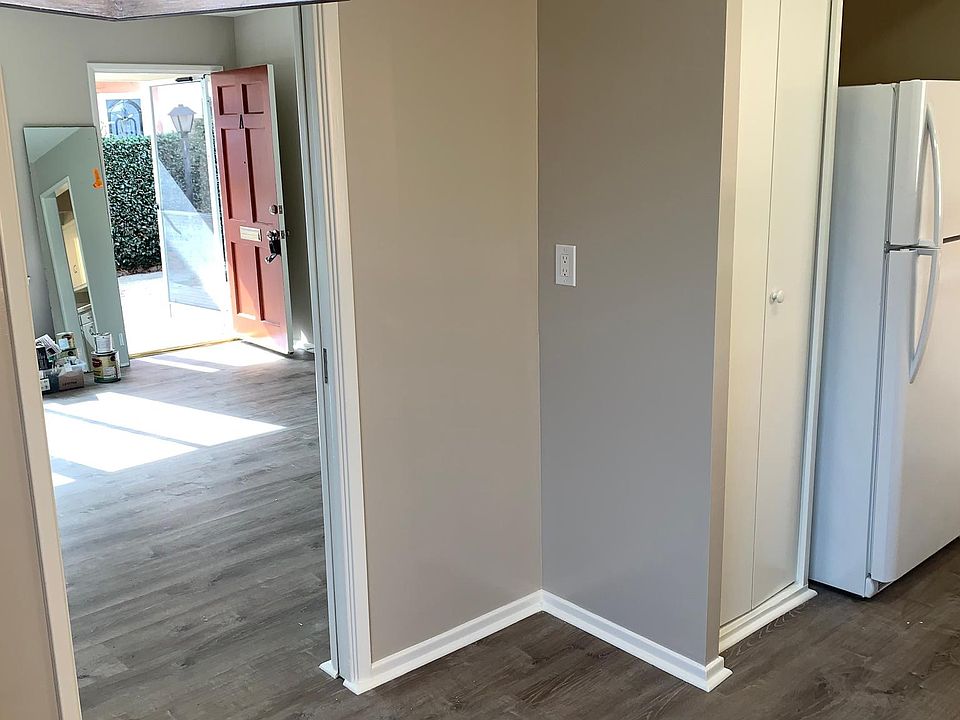 View as seen from the rear door with kitchen on the Right side and the living room on the Left of photo