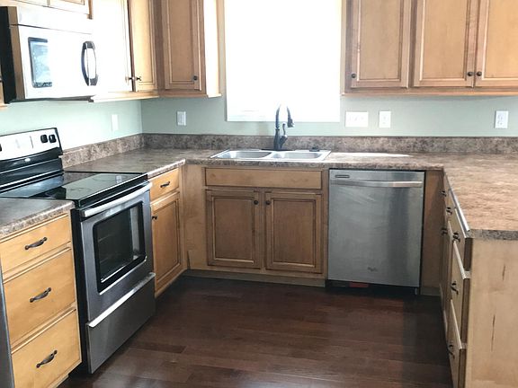Stainless steel appliances. Custom made cabinets