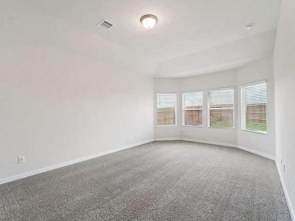The primary bedroom of a home in Wall Street Village of Richmond, TX.