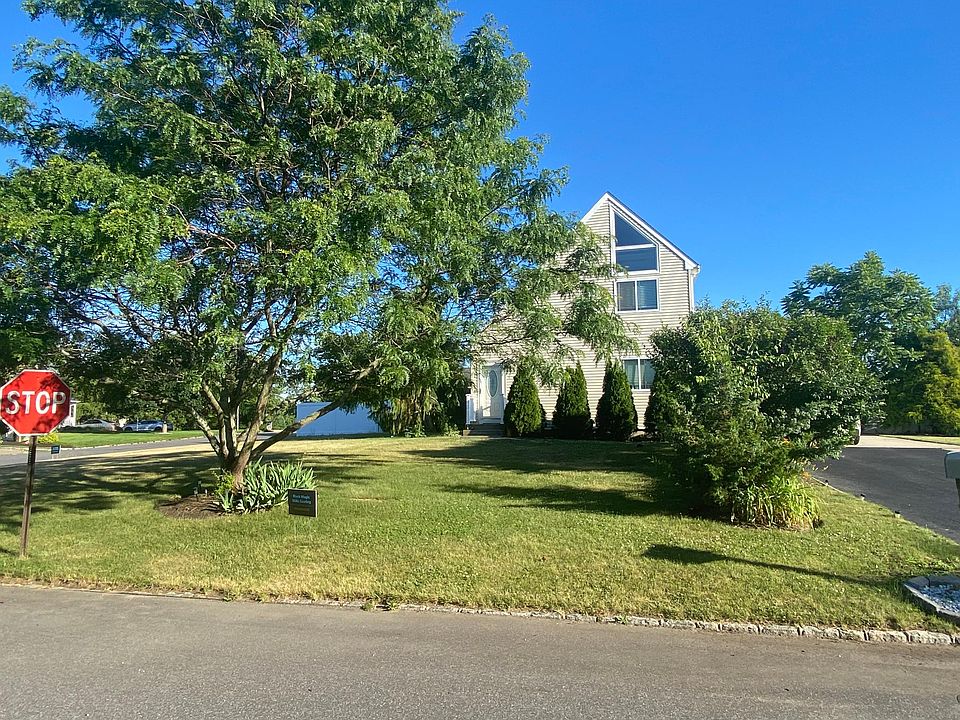 Front of beautiful home on corner lots. Tons of yard space in front as well as parking