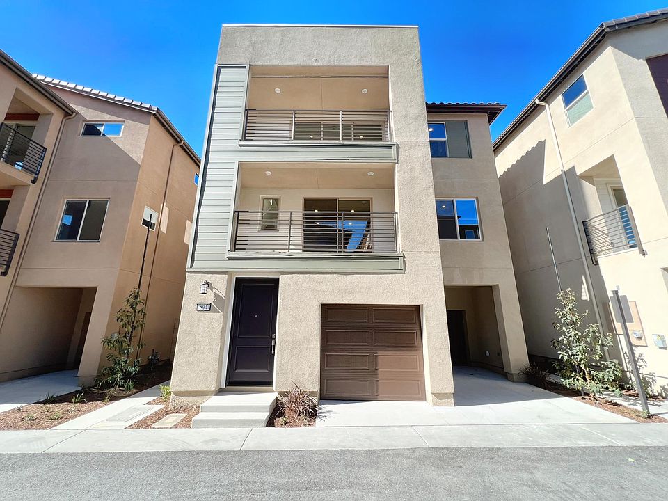 Front: Two Car Garage & One Car Drive Way
