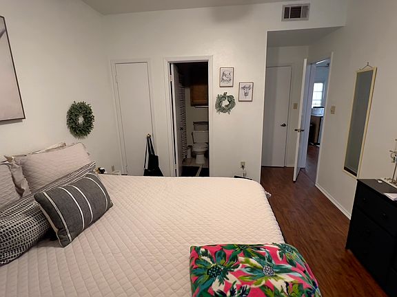 Room 1 has a walk-in closet and its private bathroom. The French door leads to a balcony.