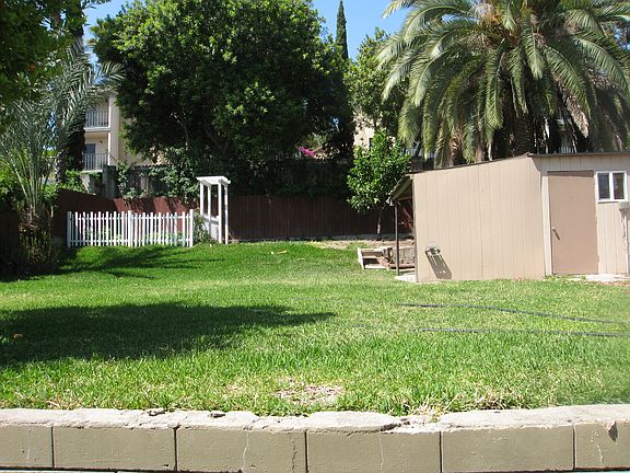 Fenced Backyard with Arbor and Storage Shed (Shared)