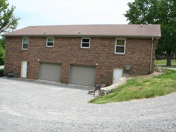 Back of Duplex showing garage and service door. (Unit B is on the left side of photo)