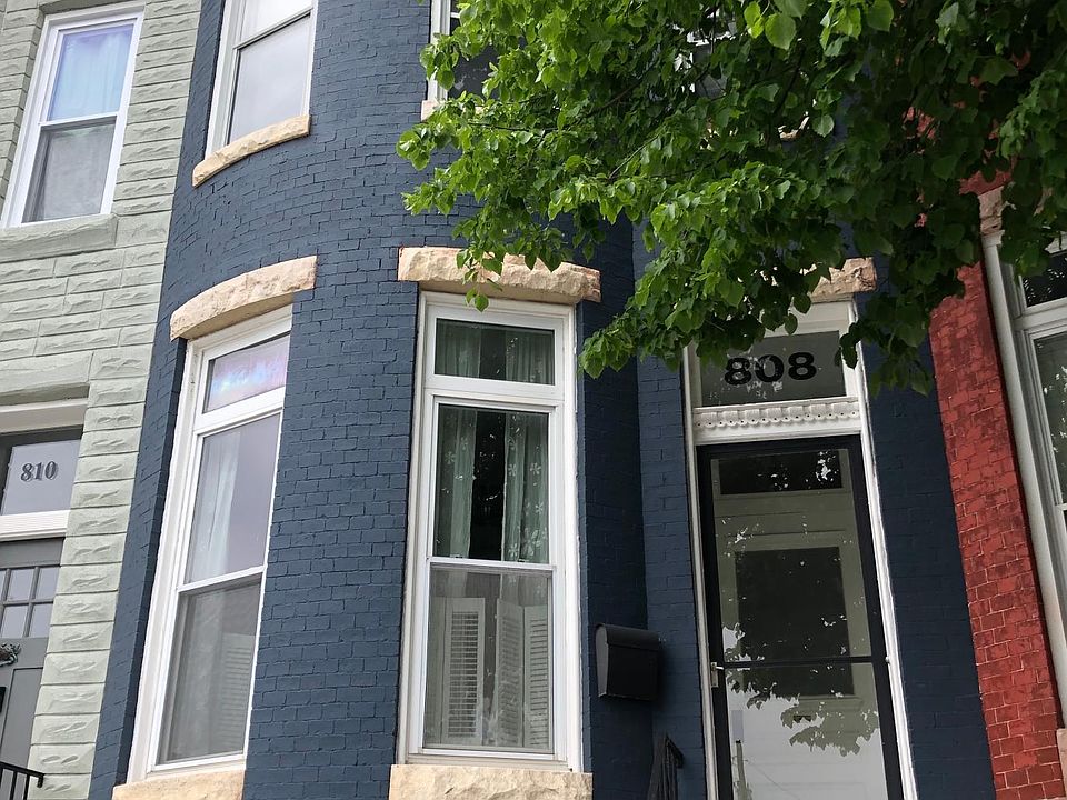 Front of home: Classic Bow front with cornice detail.