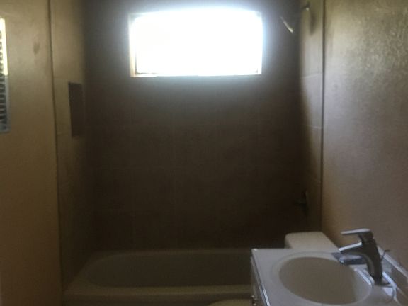 Hall bath with tile shower 