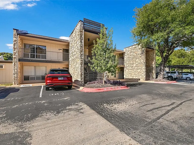 Front of unit with reserved parking spot