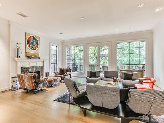 A huge Living Room with natural light pouring in from windows with great views. Note the two sitting