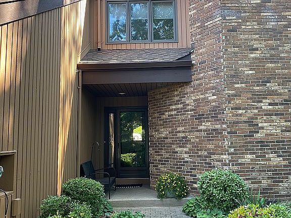 Lush landscaping. Garage 