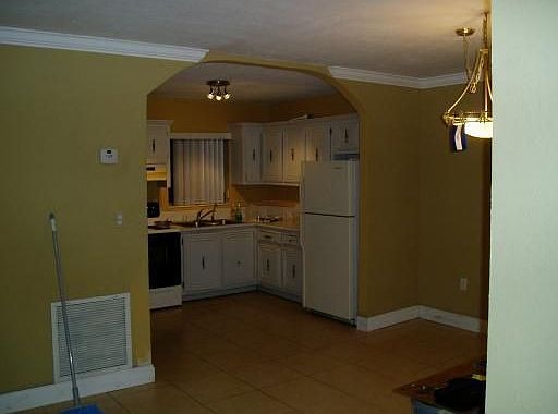 New crown molding, baseboards and tile