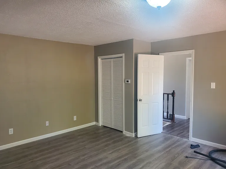 Main living area and passage to bedroom three and second living area/office.