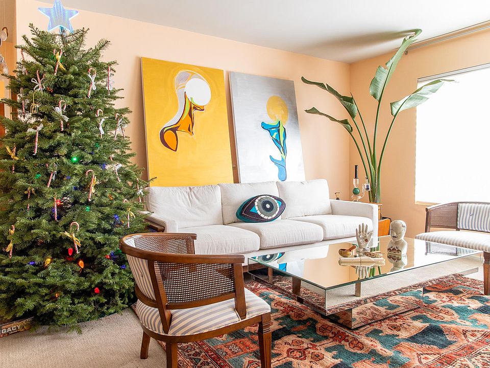 Living room (dated photo, now includes a 75" Samsung TV, more art, instruments, a telescope, and not a Christmas tree)