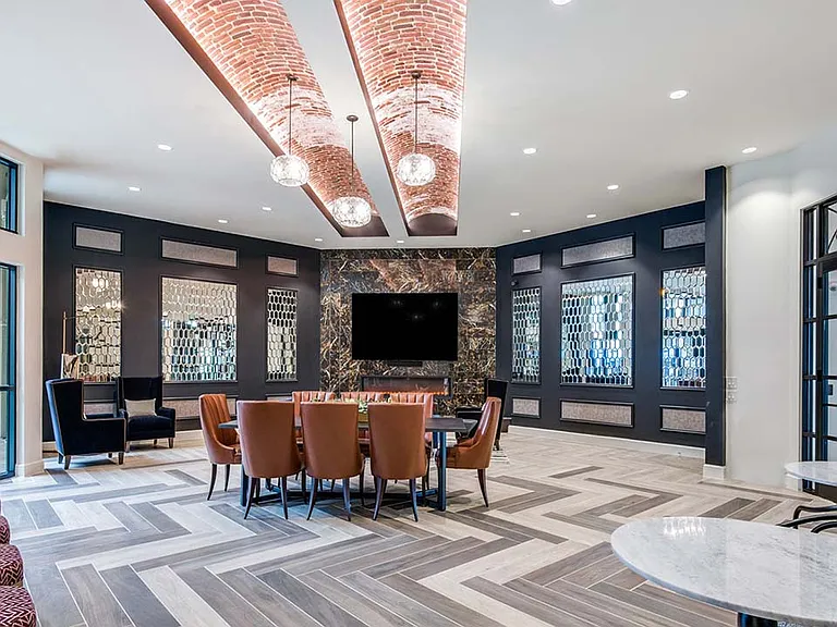 Griffis Frisco resident lounge with fireplace.