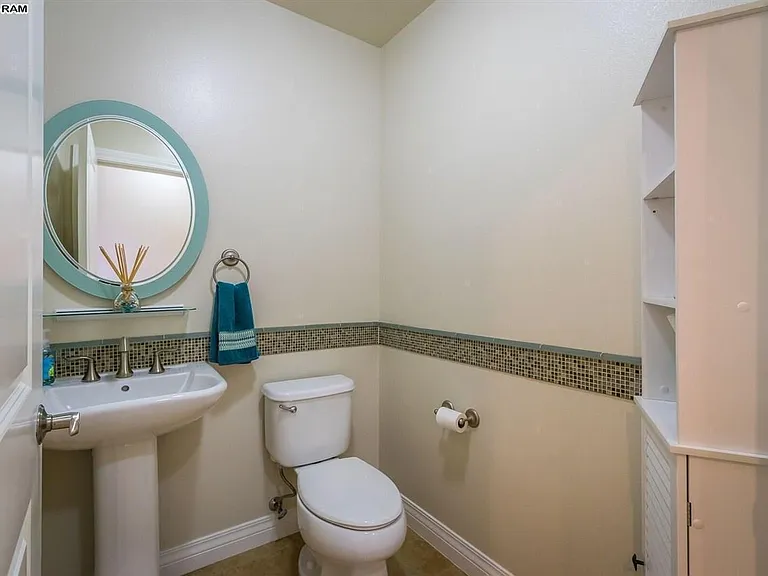Powder room near entry.