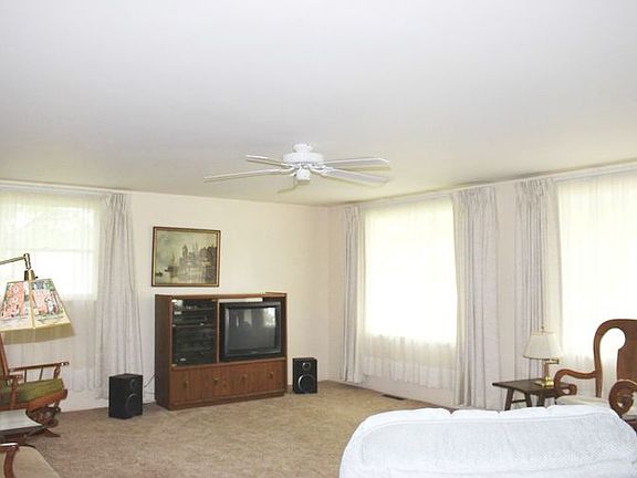 Spacious living room with picture windows and fireplace. This room is 19x15!