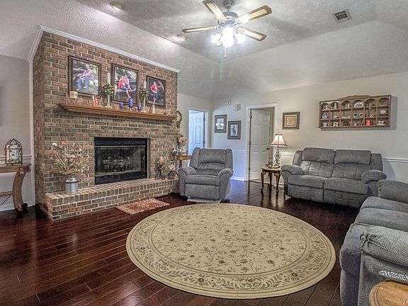 Great living room with a beautiful, brick fireplace