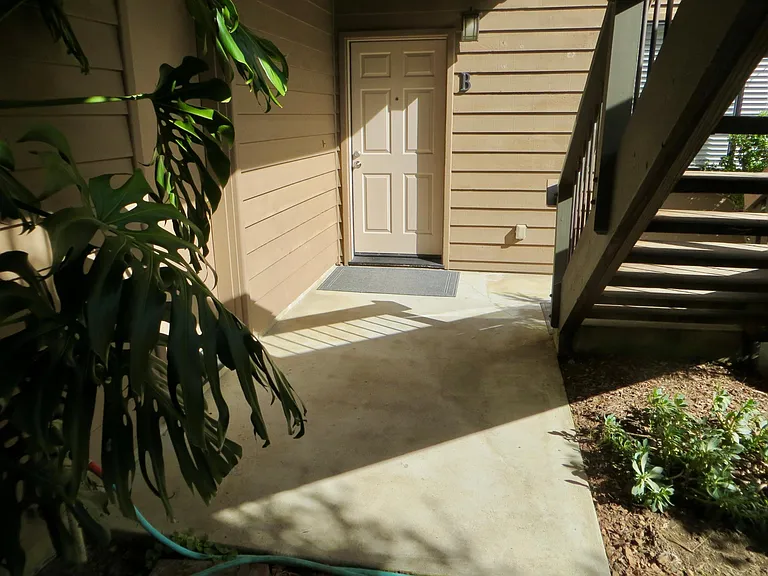 Front door at entry courtyard.
On left in photo: Semi-private store room