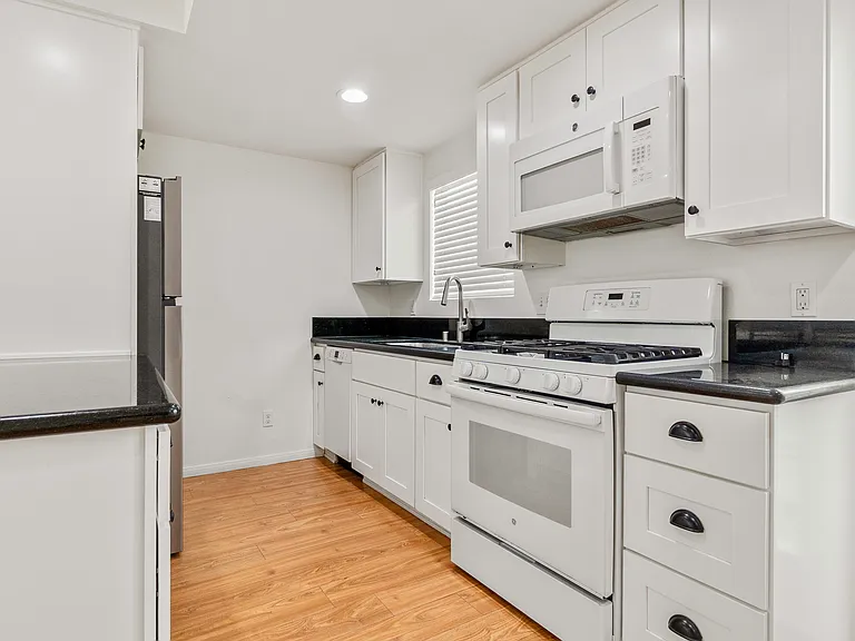 Dishwasher is at the very end of the kitchen