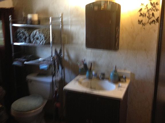 Bathroom with previous tenant's belongings