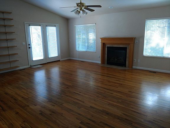Spacious living room with wood floors and gas fireplace