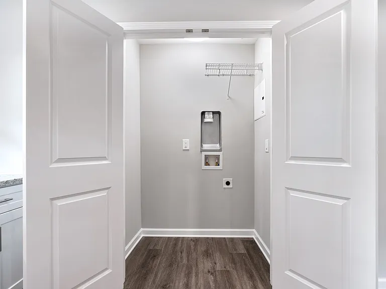 Convenient in-kitchen laundry closet with washer and dryer hookups.