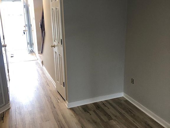View from family room to front door. New luxury vinyl plank floors.