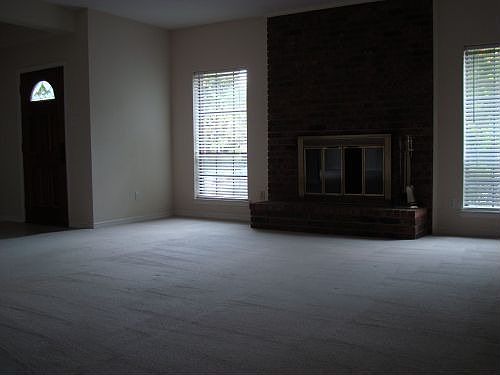 Living room opens to kitchen and dining room. The foyer is located to the left and include a closet 