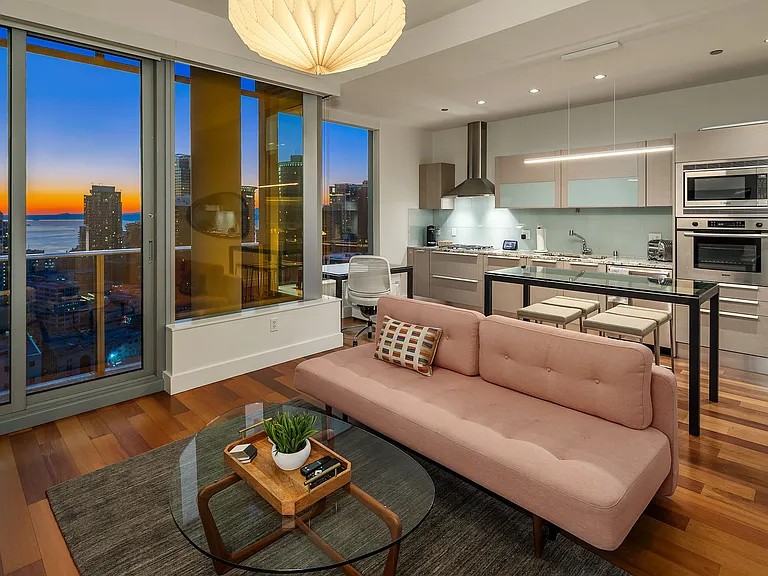 Efficient living room layout with Room & Board sofa that folds into a guest bed.