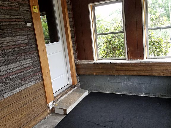 Front porch, house entry into dining room.