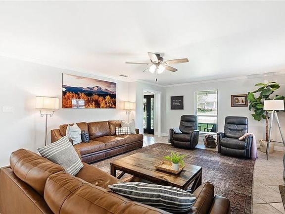 Fresh and airy living room with new ceiling fan.