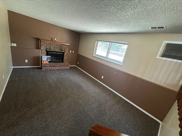 Garden level family room with fireplace.
