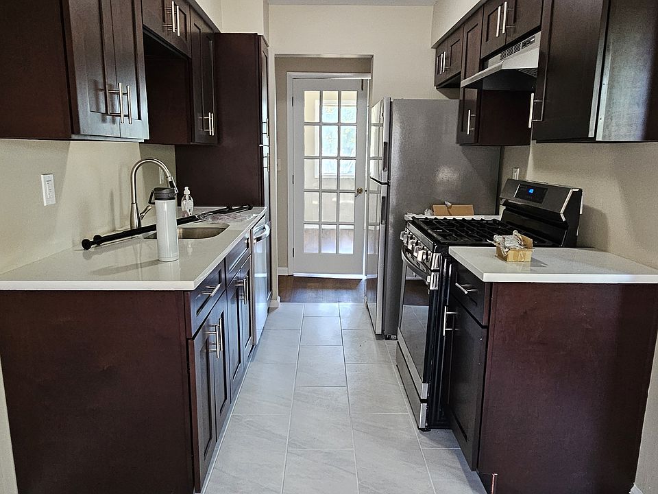 Renovated kitchen with new cabinets, flooring and appliances