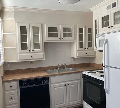 Kitchen - inclusive of full-size refrigerator, electric stove, dishwasher & disposal.