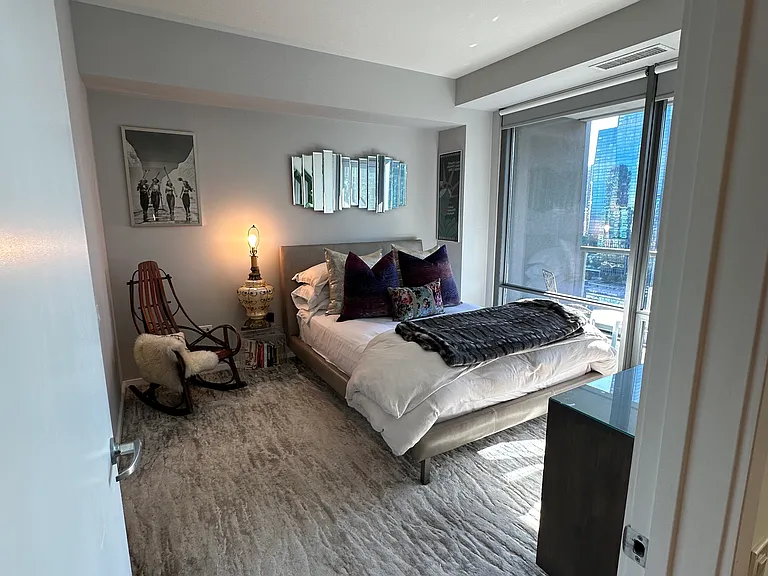 Master bedroom with floor to ceiling windows