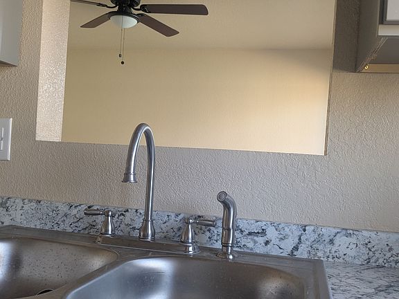 Cut out above sink between kitchen and living room...great for watching TV while doing the dishes!